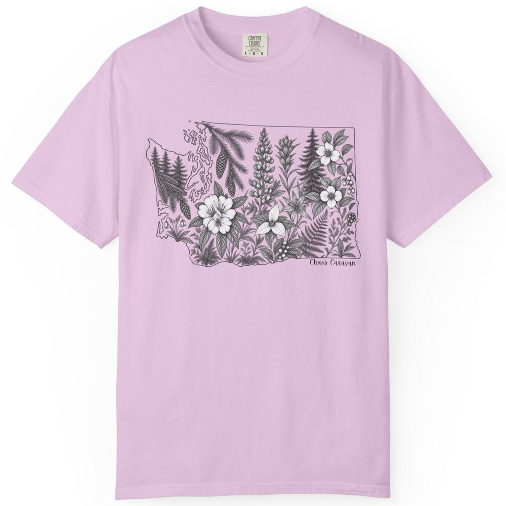 A light purple short-sleeve crewneck t-shirt featuring a black and white botanical illustration of the state of Washington filled with wildflowers on the chest, displayed against a solid white background.