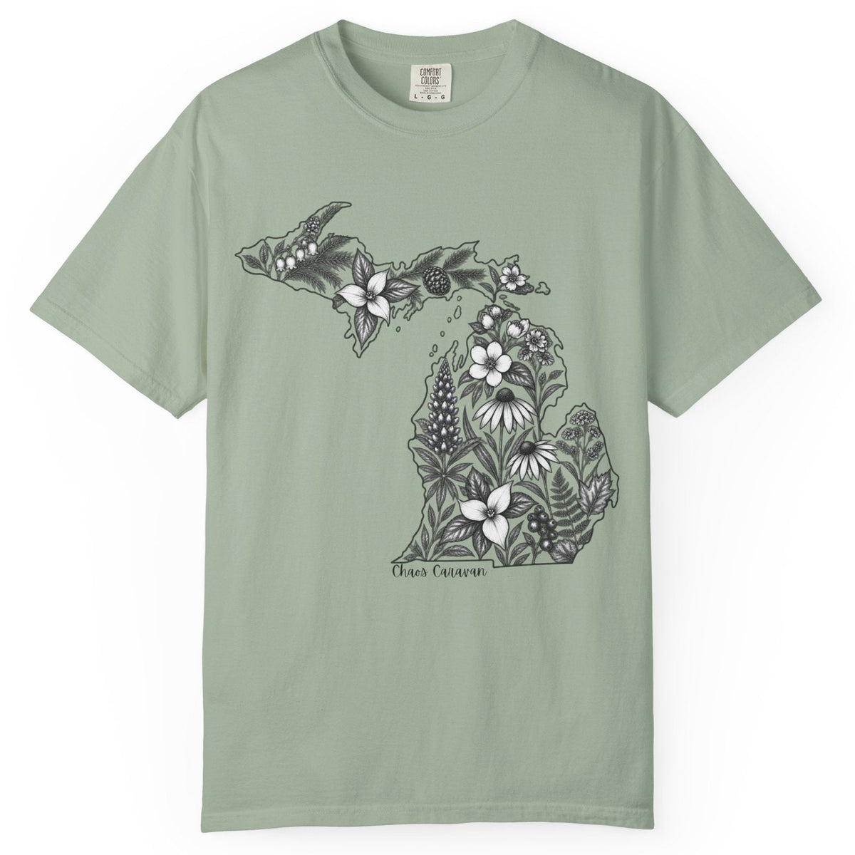 A sage green short-sleeve crewneck t-shirt featuring a black and white graphic of the state of Michigan filled with floral and botanical illustrations, with 'Chaos Caravan' printed below the map.