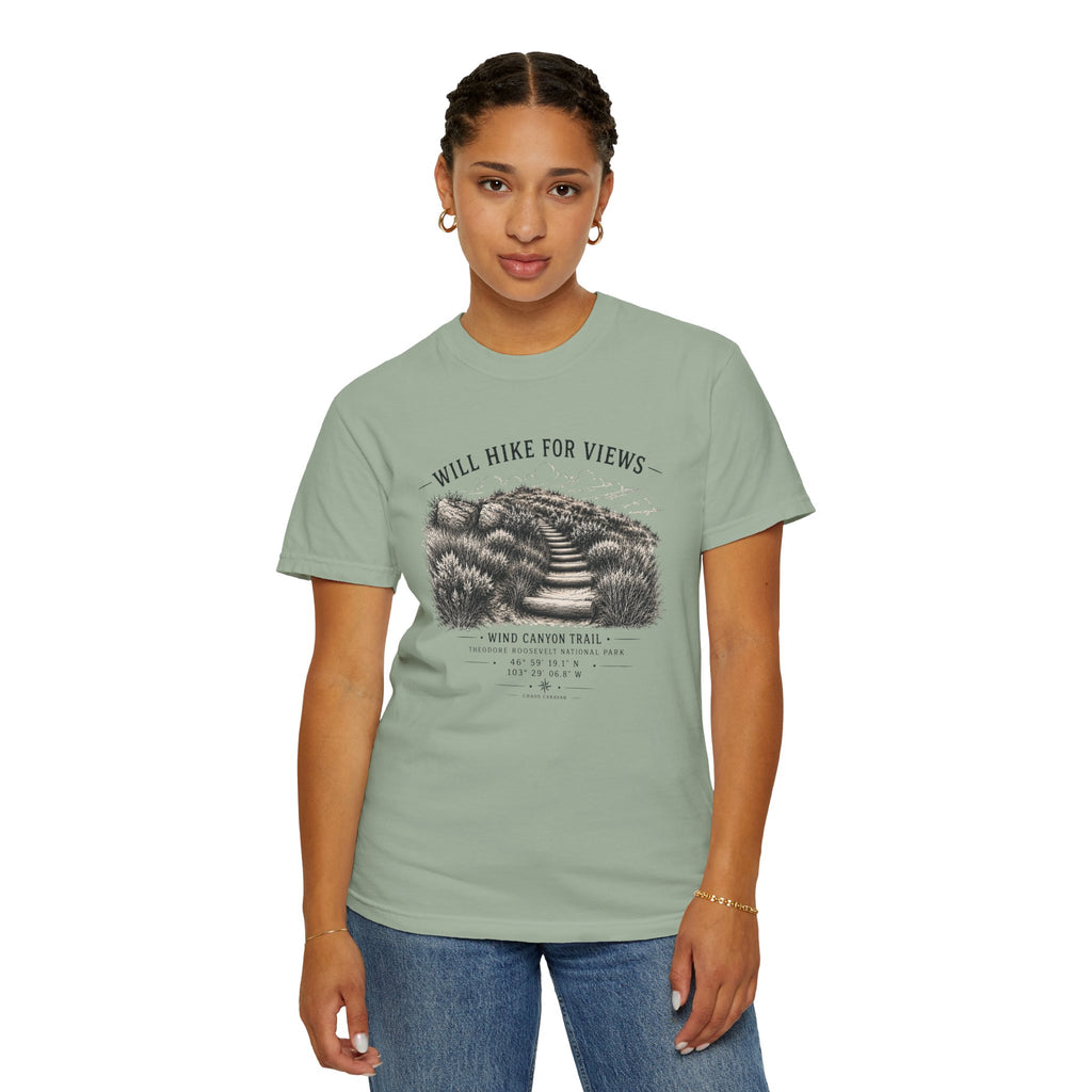Woman wearing a light green t-shirt with Will Hike For Views text on a white background
