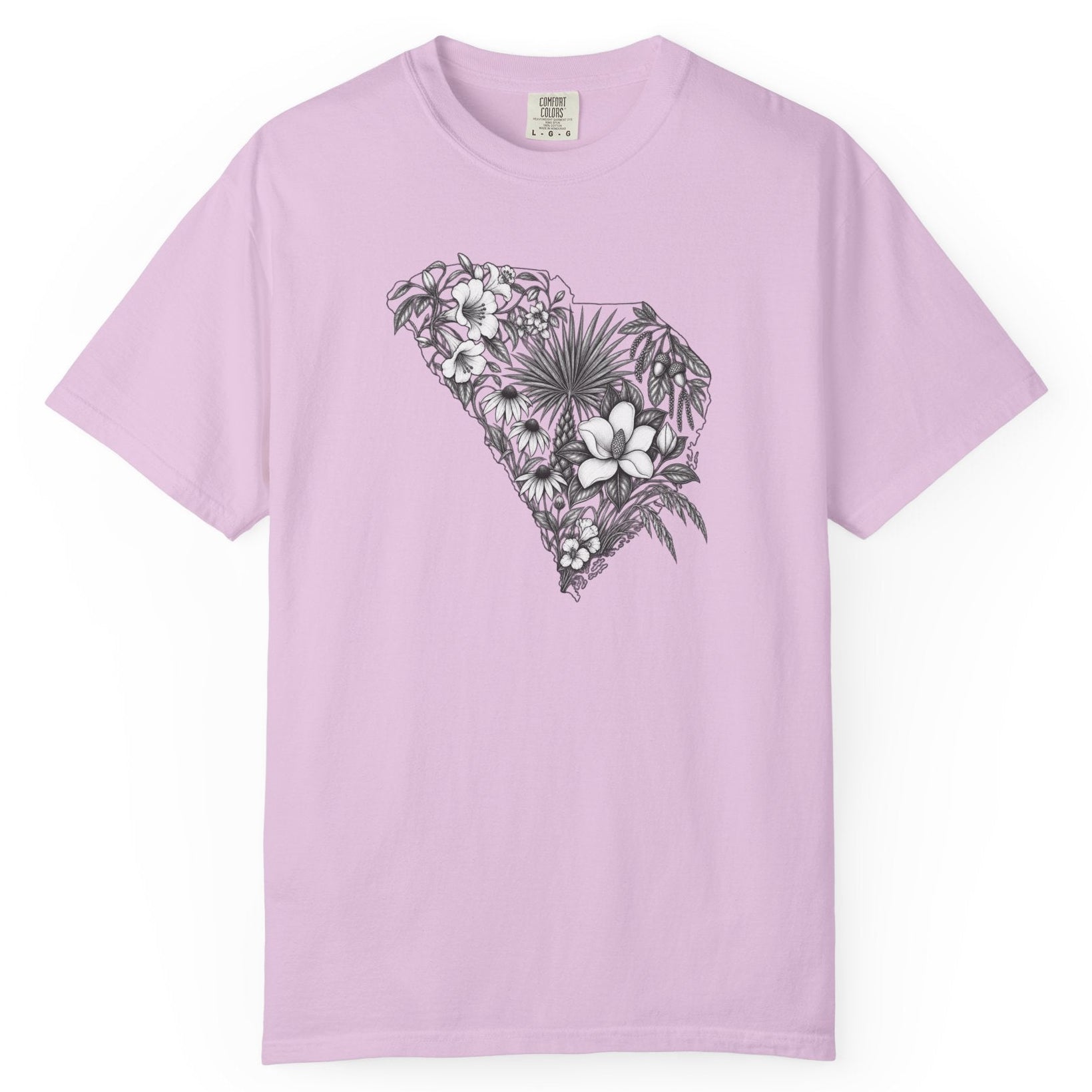 A light purple short-sleeve crewneck t-shirt featuring a central graphic of South Carolina tropical floral design in black and white, displayed on a clean white background.