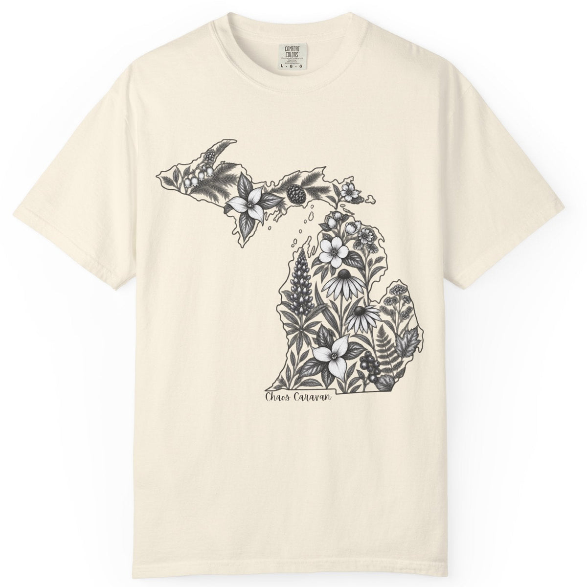 An off-white short-sleeve crewneck t-shirt featuring a black line art graphic of the state of Michigan filled with floral and botanical illustrations, with 'Chaos Caravan' printed below.