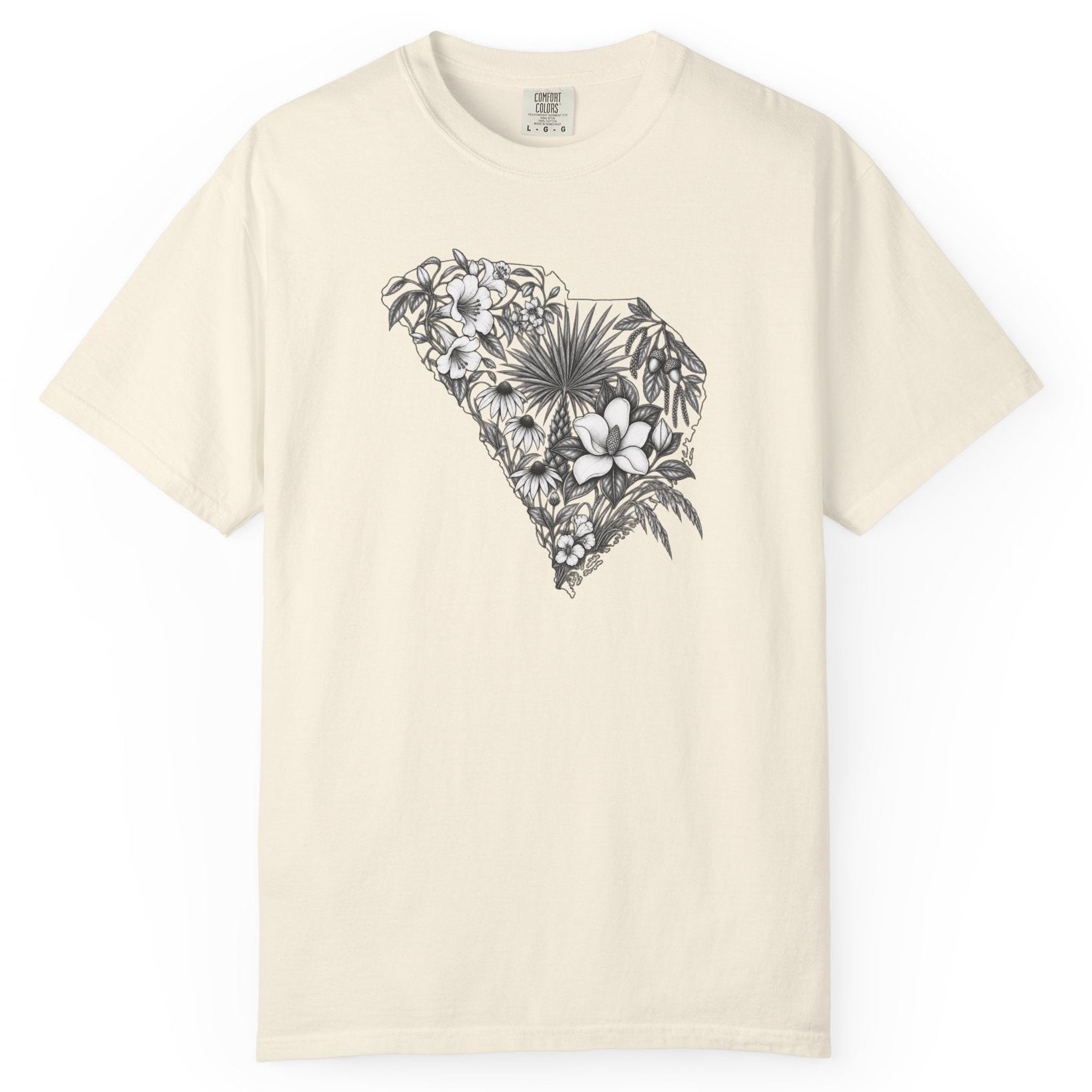 An off-white short-sleeve crewneck t-shirt featuring a black and white tropical floral South Carolina graphic on the chest, displayed against a solid white background.