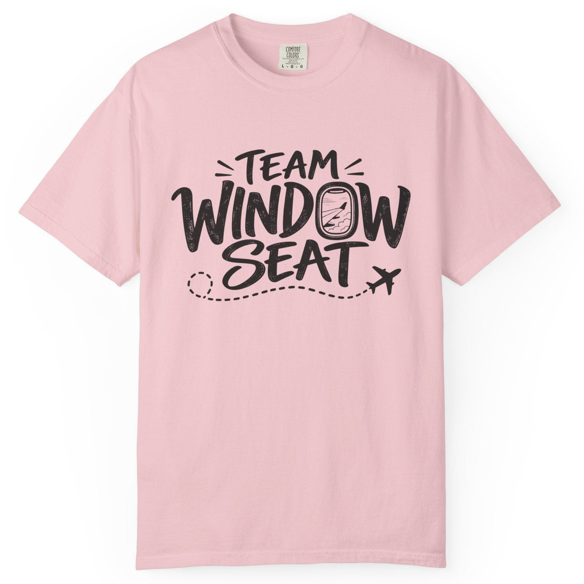 A light pink short-sleeve crewneck t-shirt with a black graphic print on the front that reads 'TEAM WINDOW SEAT' with a small airplane icon, displayed on a clean white background.